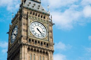 Image shows a close-up of Big Ben against a blue sky background.