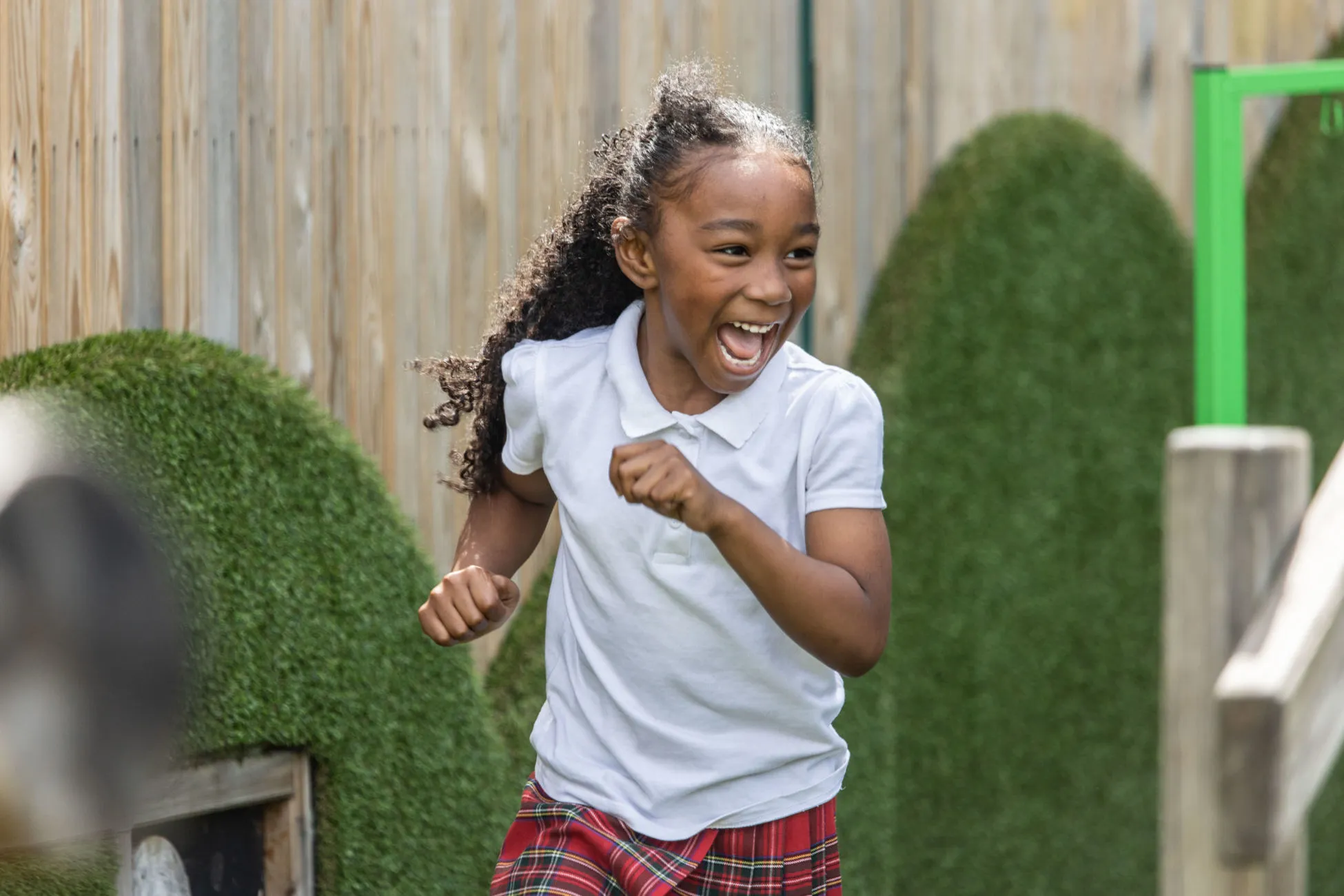 A girl playing in a school playground