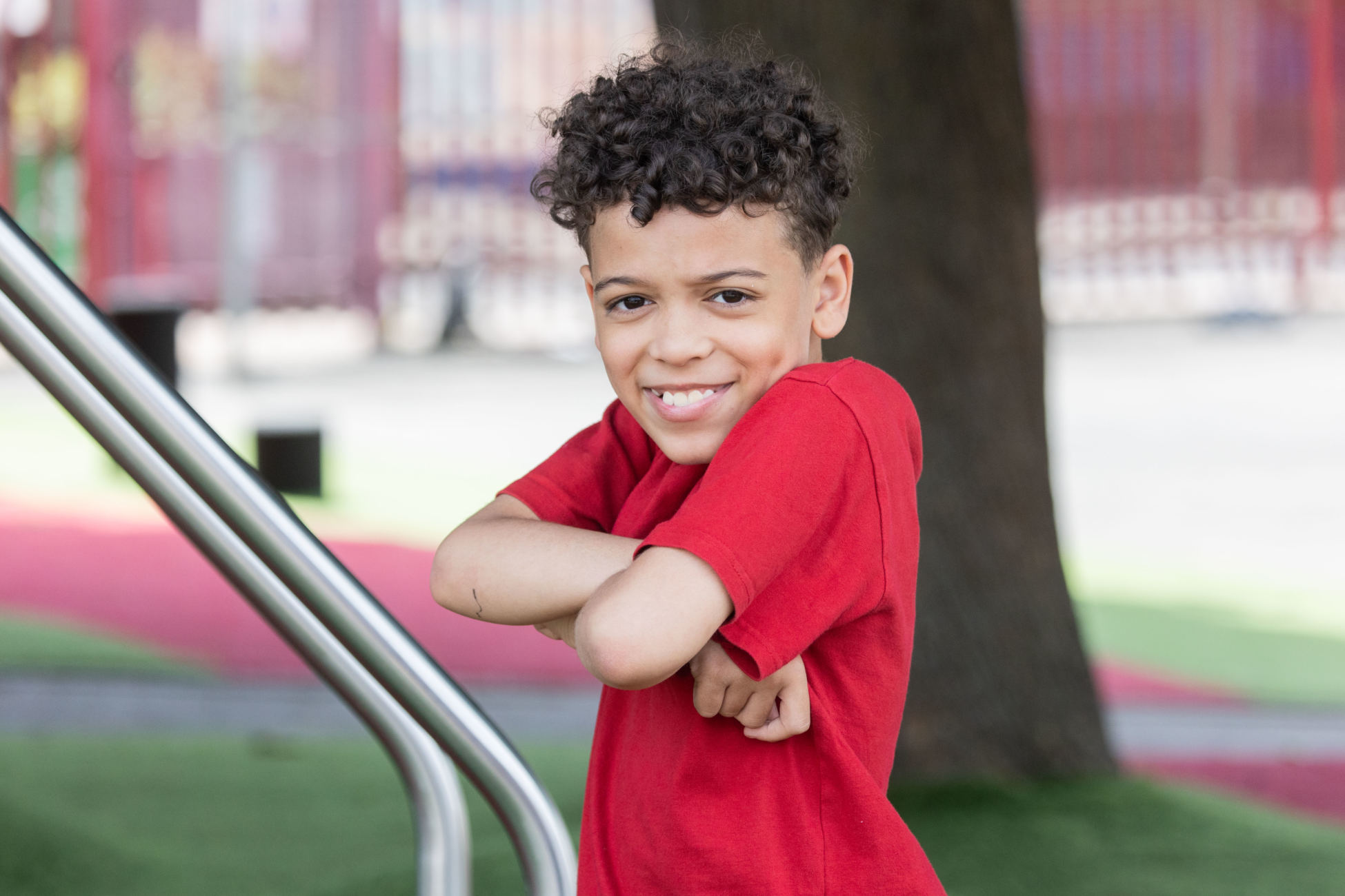 A boy posing in a school playground