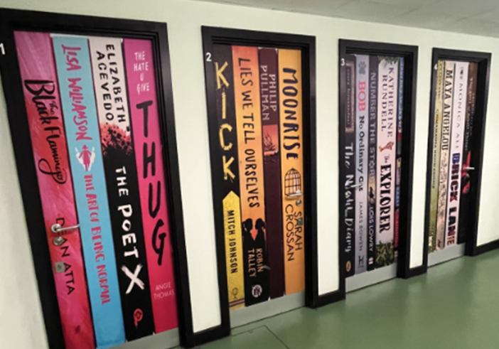 Two of 18 doors displaying popular reads including Staff YA Book Club and Tutor group reads