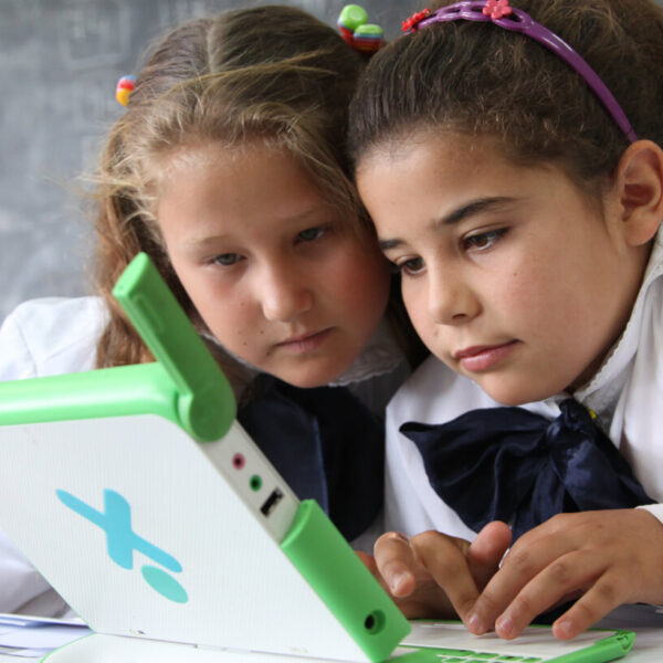 Alison, 8, and Roclio, 9, use a special laptop at a rural school in Uruguay. We are working with the government to promote digital inclusion in order to reduce the digital divide between rural and urban. Unicef/2013/Pirozzi