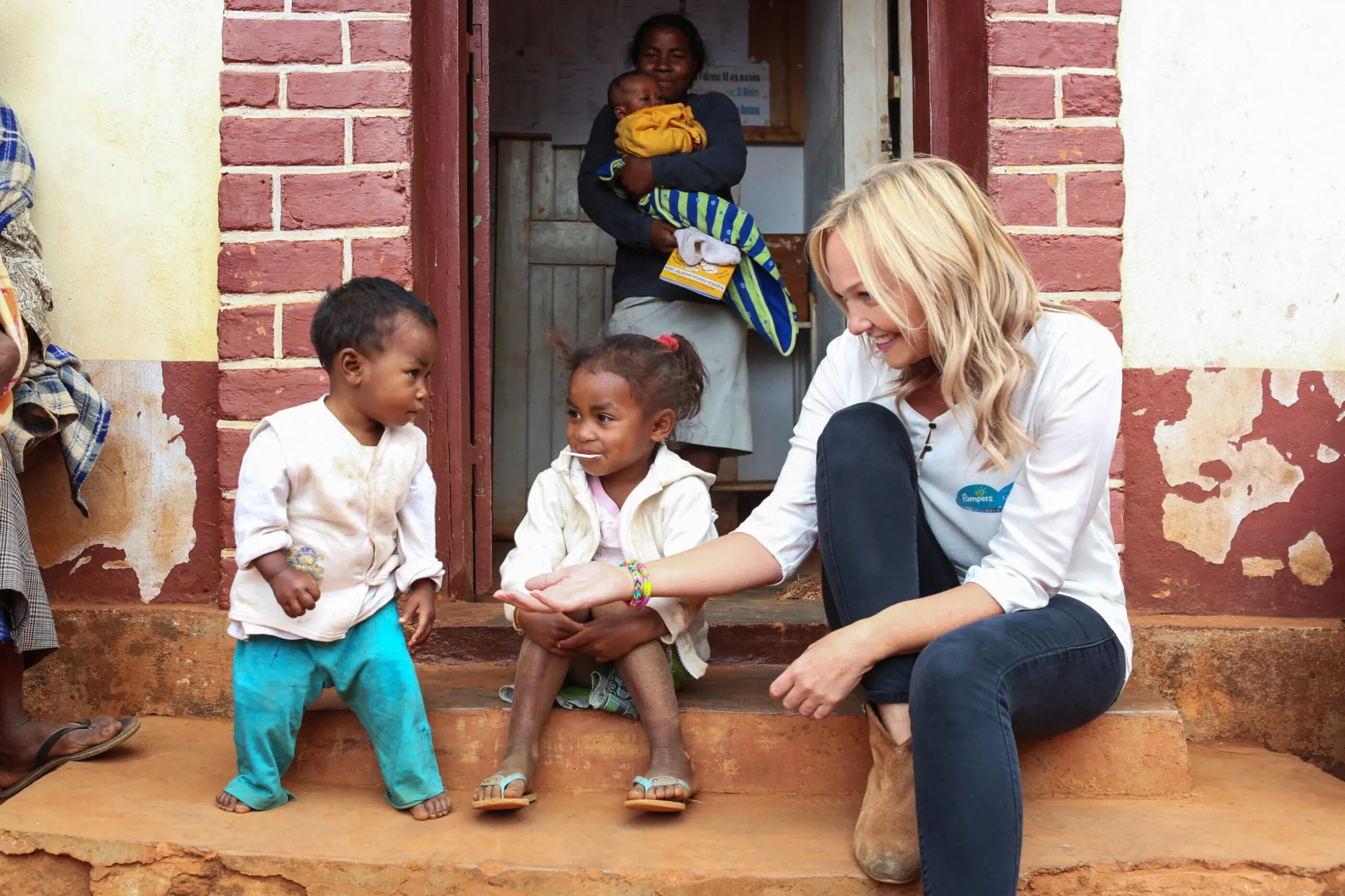Emma Bunton, Unicef UK Ambassador with Tania Rasoniaina (1 year old) and Natacha Rasoniaina (4) at the Ankadinandriana Health Center. Pampers and UNICEF '1 pack = 1 vaccine' campaign to support the fight against Maternal & Newborn Tetanus. Ankadinandriana, Madagascar. 25th July 2014. Picture by Jordi Matas