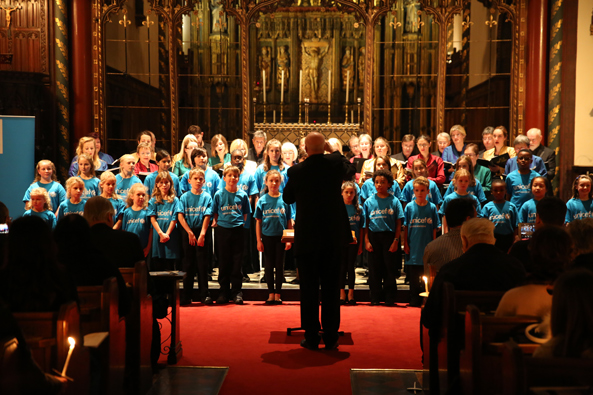 Students from Allfarthing Primary School giving a rendition of Away in a Manger with the Joyful Company of Singers. Unicef UK 2014