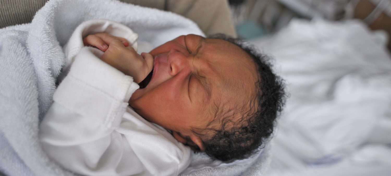 Baby-Friendly Initiative - a newborn yawns. Unicef 2012 Jeffs