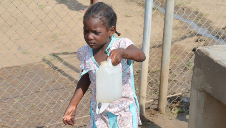 A girl collects water from a solar powered pump in Blue Nile State, Sudan.