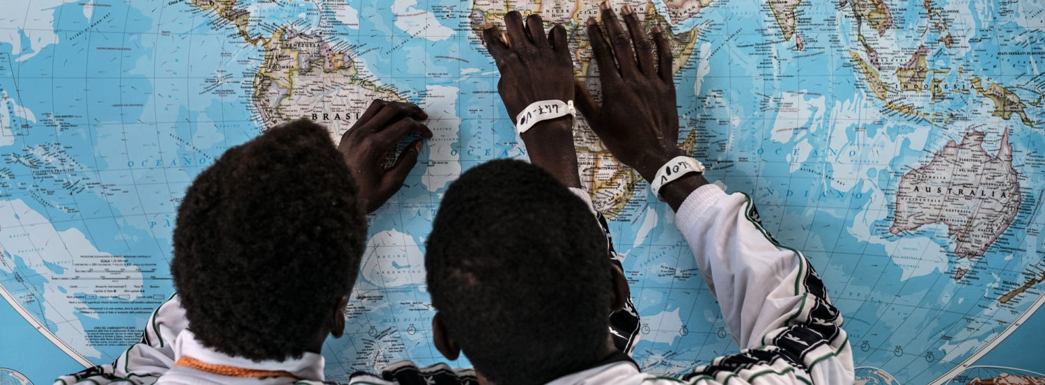 Gambian asylum seekers discuss their route at an Italian reception centre in Sicily. Unicef 2016 Gilbertson VII