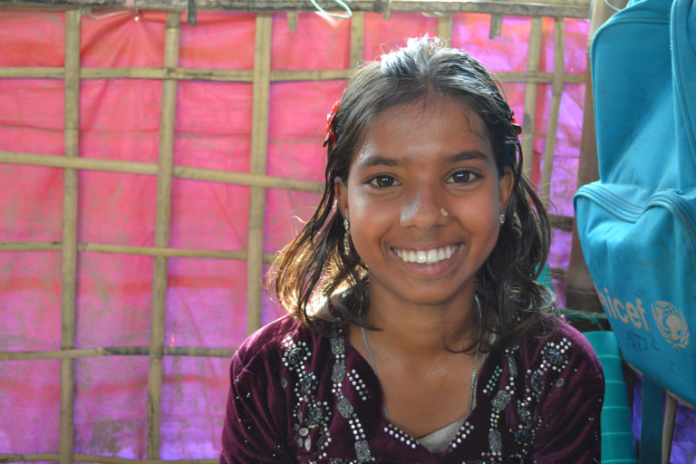 Samira, 12, fled her home in Myanmar and now lives with her family in a camp for Rohingya refugees in Bangladesh. She goes to the Unicef-supported child-friendly space where she has a chance to learn, play and remember what it's like to be a child again. Unicef/2017/Yoo