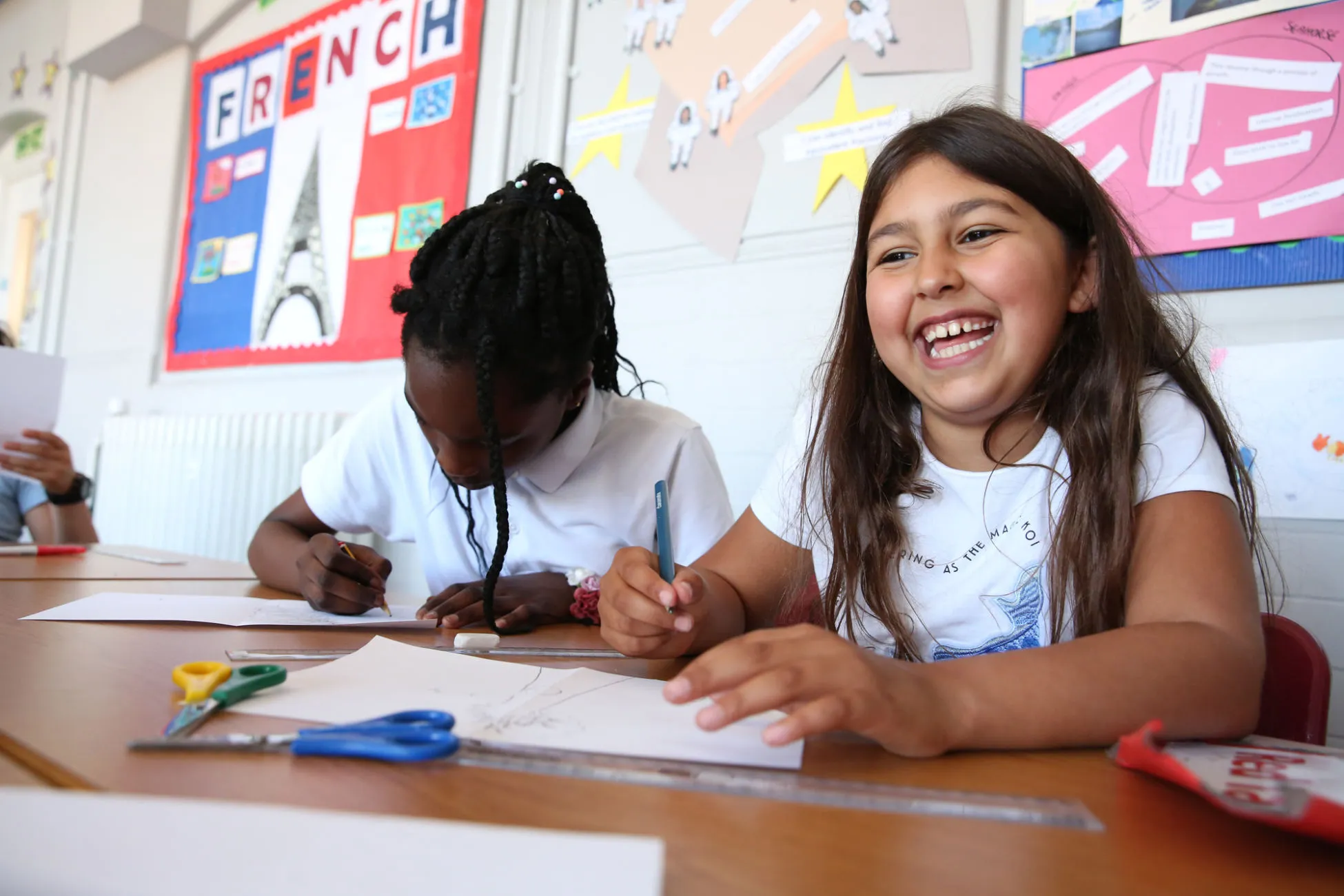 Children draw how the world would look if air pollution continues on one half and how the world would look without air pollution on the other half. We want every child in the UK to grow up breathing clean and healthy air to ensure they have the best opportunity to live a happy, healthy life. Photo: Unicef/2018/Dawe
