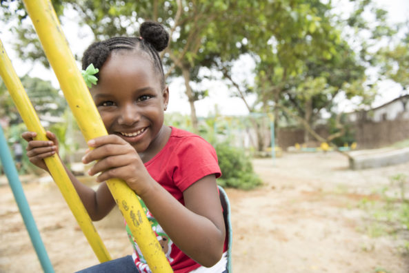 5-year-old Perculiare plays at a Unicef-supported early childhood centre in Liberia. You can support children like Perculiare through a Gift in Your Will. Join the Unicef Generation.