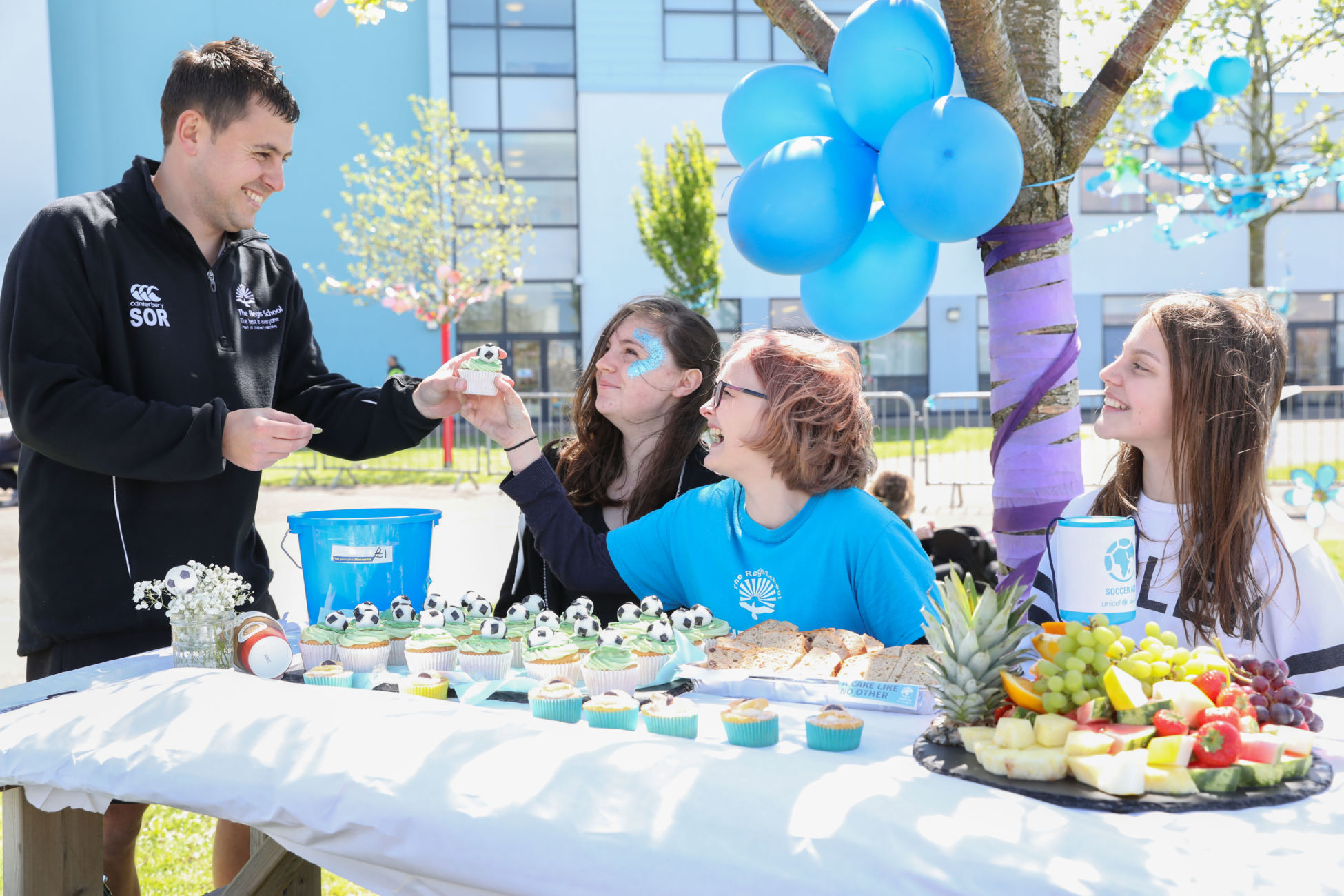 Group of children holding a bake sale at school