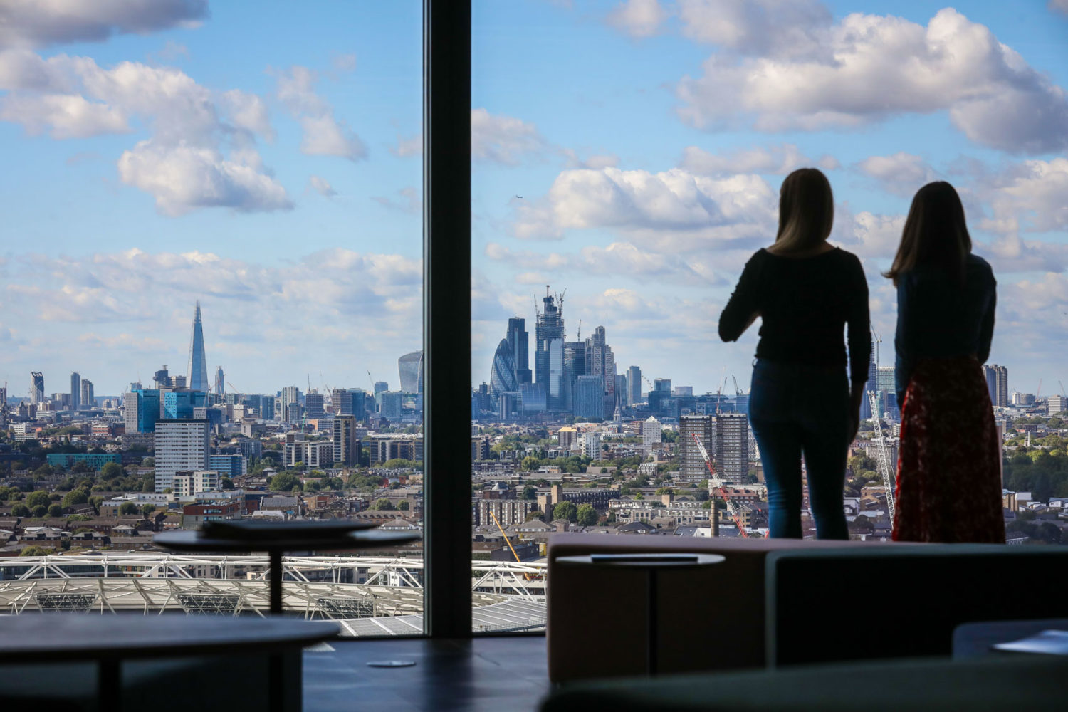 Staff looking out of the reception window to City of London.