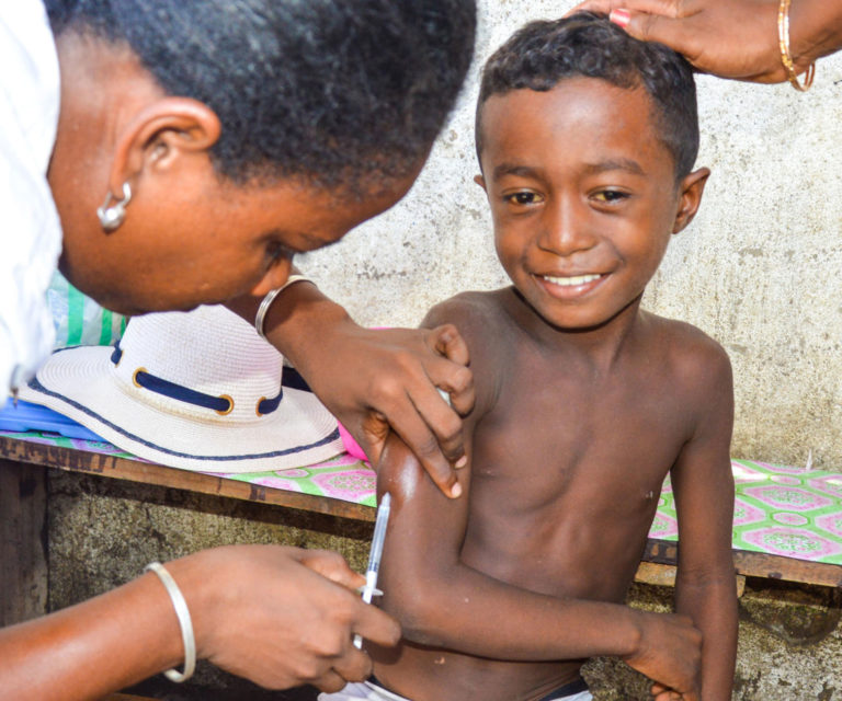 A child receives a measles vaccine