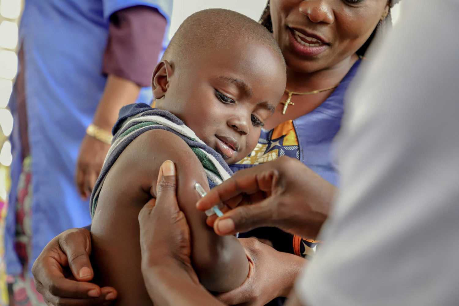 A boy receives his measles vaccine in the DRC