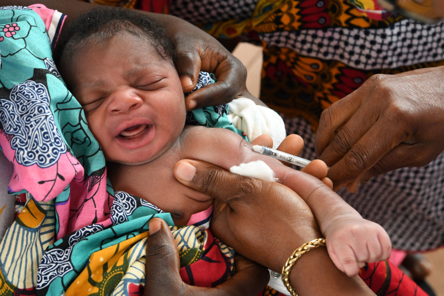 A baby receives vaccinations in Cote D'Ivoire