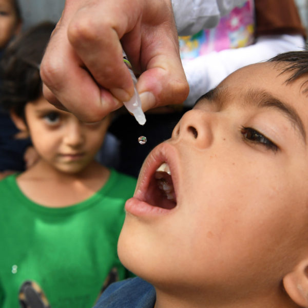 A child is vaccinated against polio