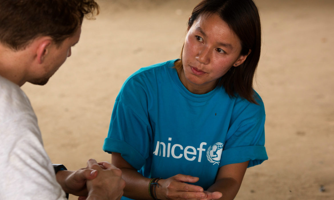 Tom talks to UNICEF South Sudan Child Protection Specialist, Joy Wai Ping Cheung about the dangers children face in South Sudan, at the UNMISS protection of civilians camp in Malakal, Upper Nile State, South Sudan on February 28, 2015. includes nutrition, health, WASH, education and protection programming.