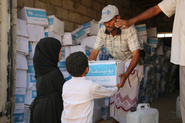 Siham Anis Ali Ahmed Al-Bahri, 9-years-old, and her little brother, receives health supplies in Hadramout Governorate, Yemen
