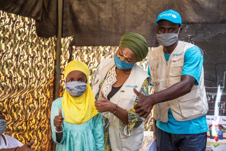 Fatoumata, 11 years old, in the company of the UNICEF team raising awareness about coronavirus