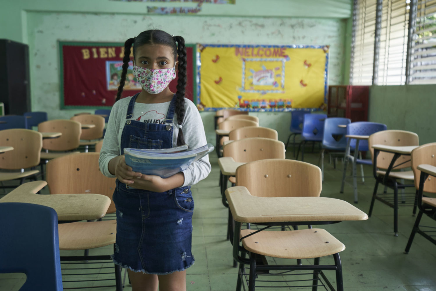 A student on an empty school in Panama City, Panama, on 16 Sept 2020.