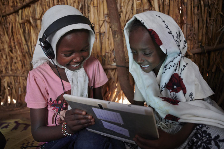 Girls use tablet at UNICEF-supported centre in Eastern Sudan