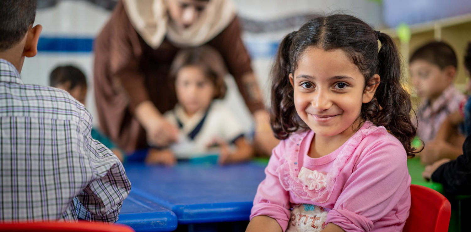 Girl getting an education in a classroom in Jordan. UNICEF/Herwig