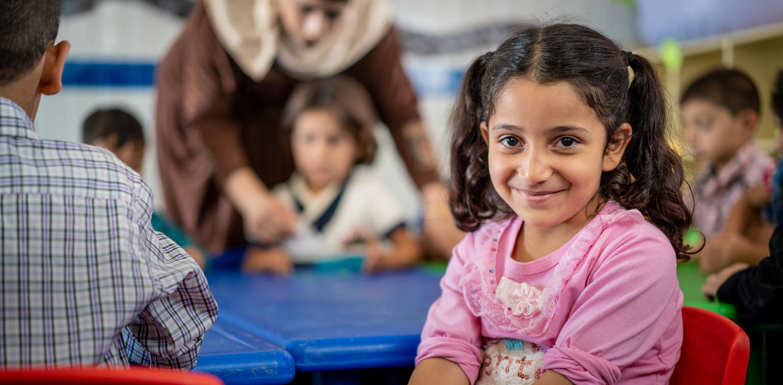 Girl in classroom in Jordan. UNICEF/Herwig