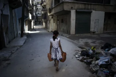Picture has young girl hold empty bottles in her hand, and on the right hand side is a pile of rubbish, which relate to the issue of climate change.