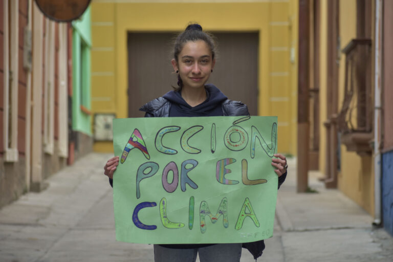 Girl holding sign