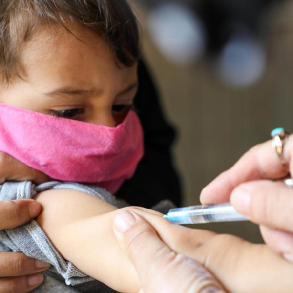 A young child receives the measles vaccine