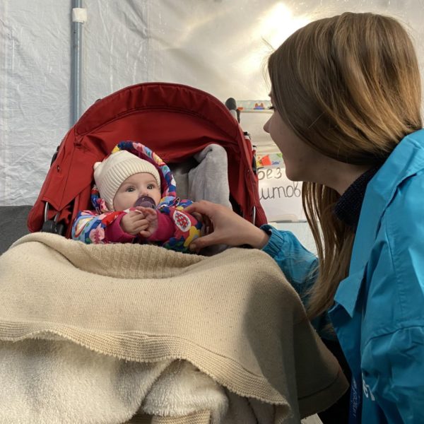 baby in pram wrapped in warm blankets