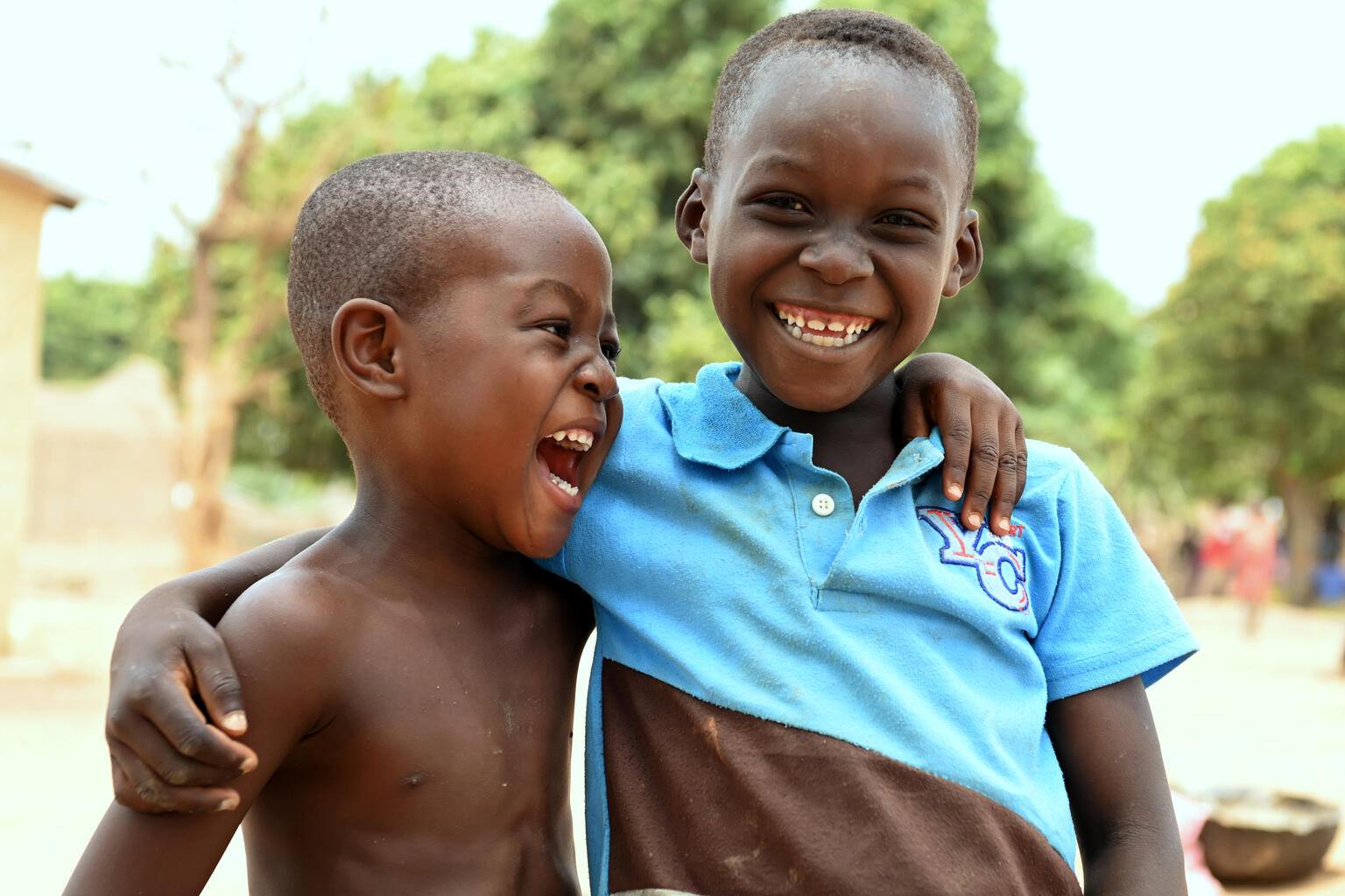 Two smiling and laughing refugee children from Burkina Faso. Picture taken in a refugee camp in Tougbo, in the north of Côte d’Ivoire.