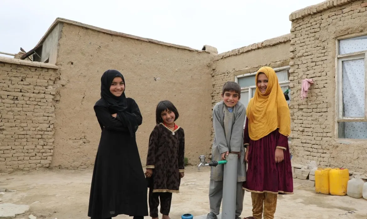 Children stand by their new water tap near their home in Maidan Wardak, central Afghanistan. UNICEF completed a solar-powered water network for displaced Afghans in the province. Over 500 families now have 24-hour access to clean water because of this network. UNICEF also provides hygiene kits for the families, which include toothbrushes and toothpaste, soap and menstrual hygiene products for women.
