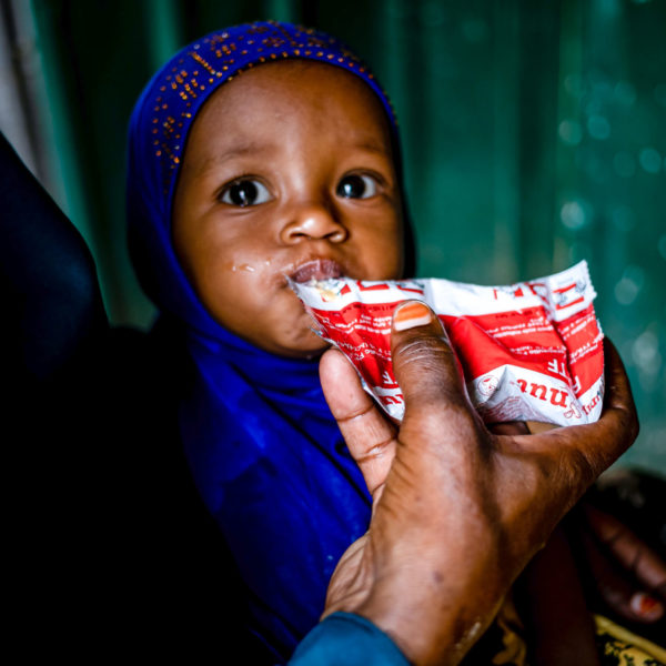Child eating therapeutic food