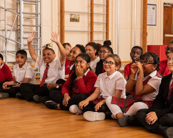 School children sat on floor