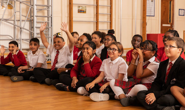 School children sat on floor