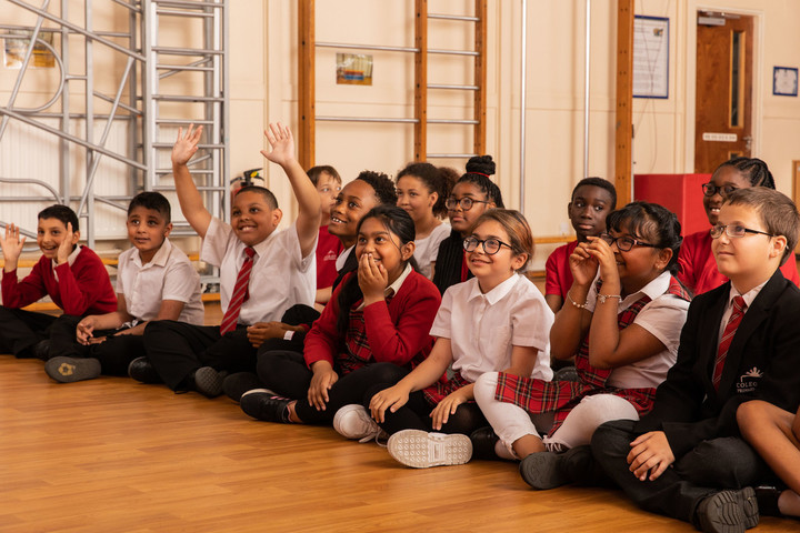 School children sat on floor