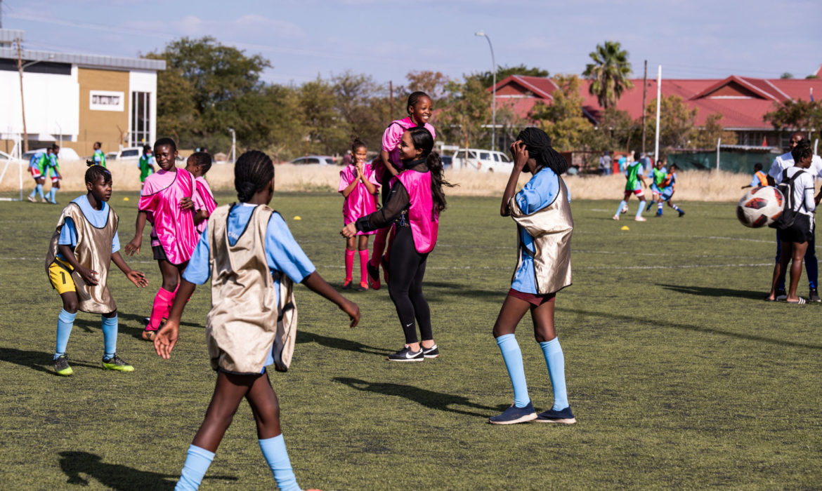 Alex plays football with the young girls at 'Galz and Goals' in Namibia