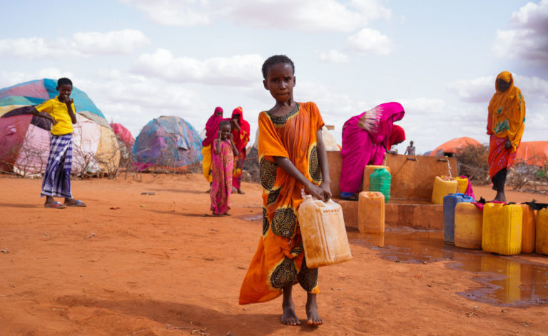 10-year-old Hibo carries water in a jerrycan Somalia.