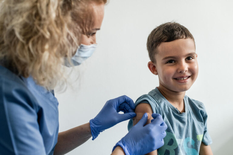 On 18 August 2022 in Kraków, Poland, 6-year-old Mykyta receives his immunizations from Nurse Ewelina Tytula at the UNIMED medical center. He left the Kyiv region of Ukraine on 2 March 2022 with his family, escaping the ongoing conflict. Mykyta is protected against measles, mumps, and rubella with the MMRvaX Pro vaccine; diphtheria, tetanus, and polio types 1, 2 and 3 with the Tetraxim vaccine; and chickenpox using the Varilrix vaccine.