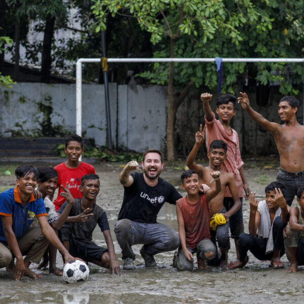Martin Compston plays football with the children from the Kamalapur Street Hub in Dhaka.