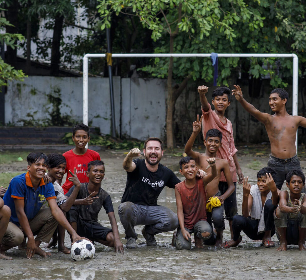 Martin Compston plays football with the children from the Kamalapur Street Hub in Dhaka.