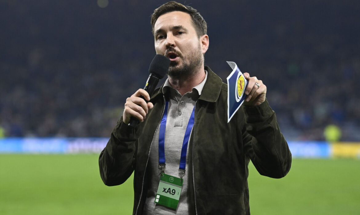 Martin addresses the fans to urge them to donate to UNICEF during an International Friendly between Scotland and Poland at Hampden Park.