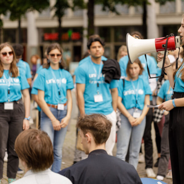 Students at a Germany university wearing UNICEF t-shirts take part in a group activity