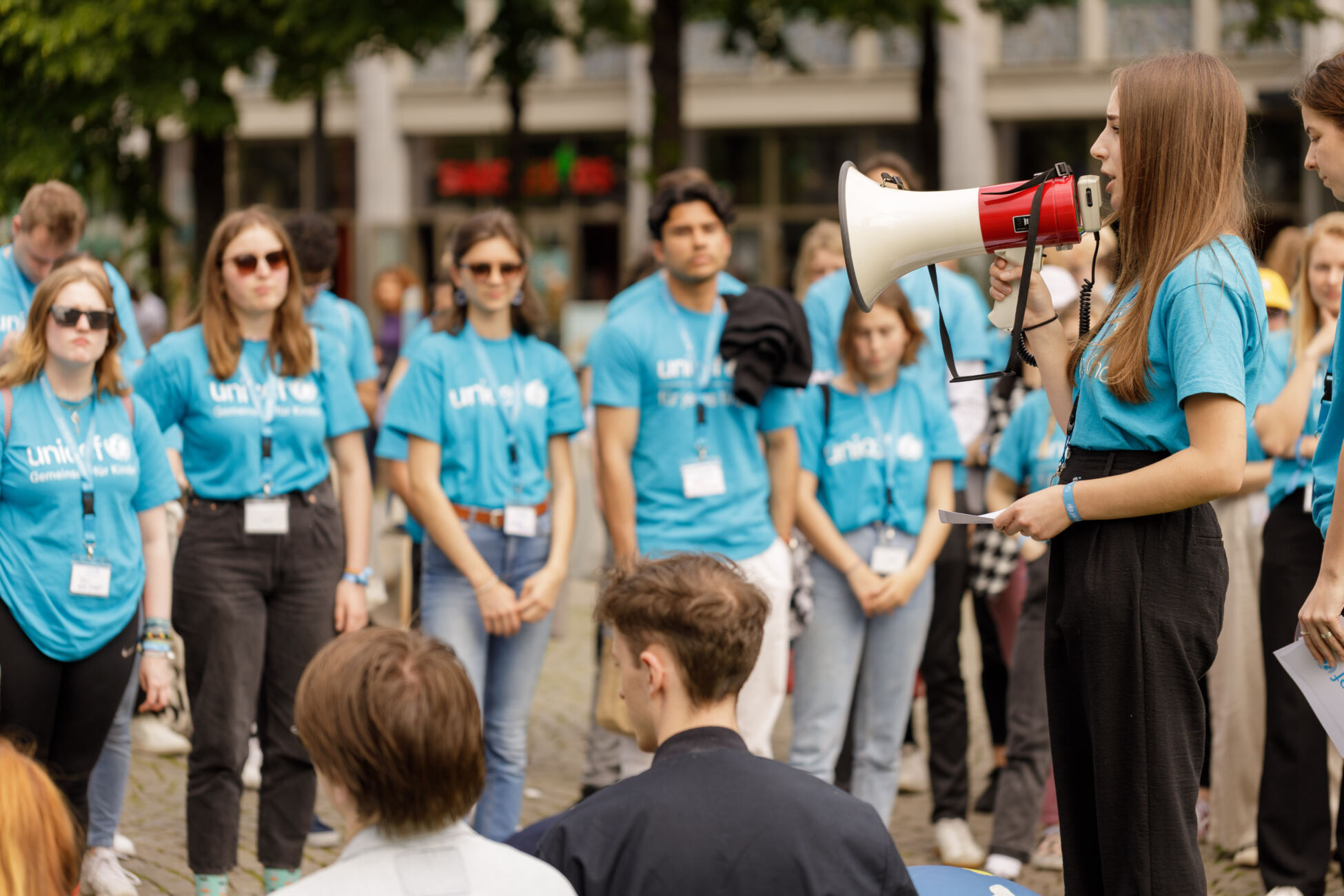 Students at a Germany university wearing UNICEF t-shirts take part in a group activity