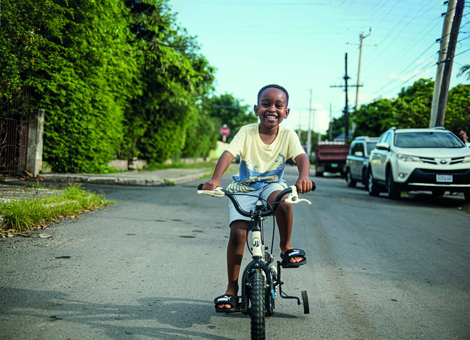 Image of Ari on a bicycle in Jamaica