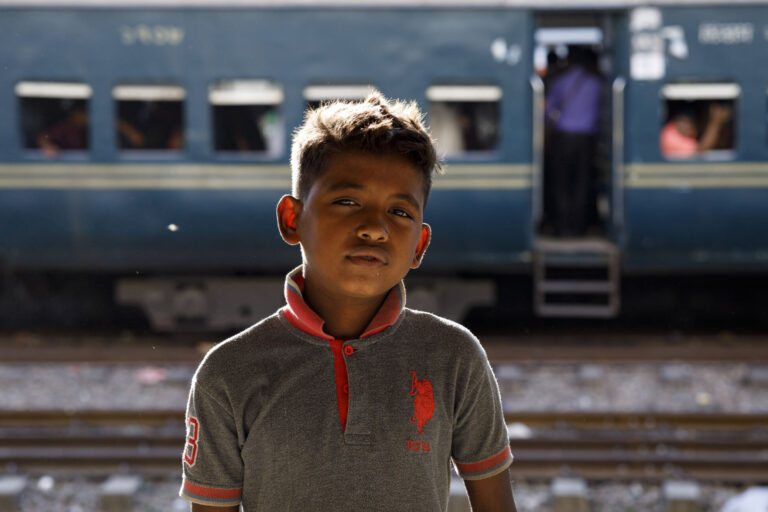 Ten year-old Nirob stand by Dhaka railway station.