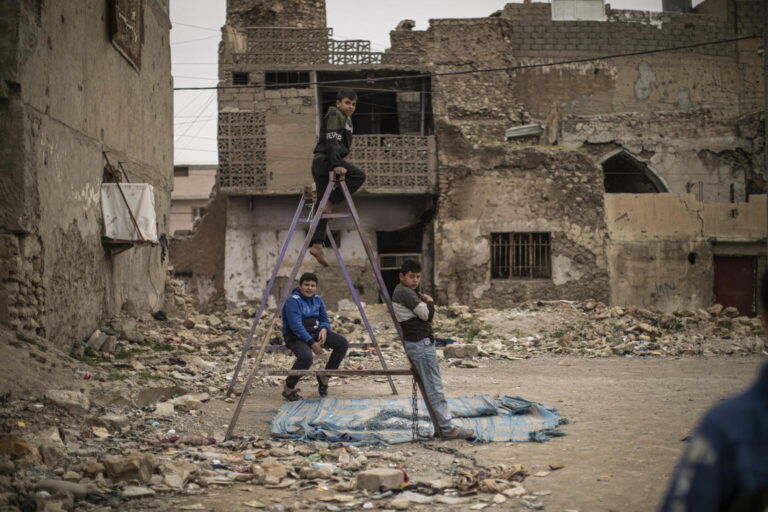 Children play at a playground in the Old City of Mosul.