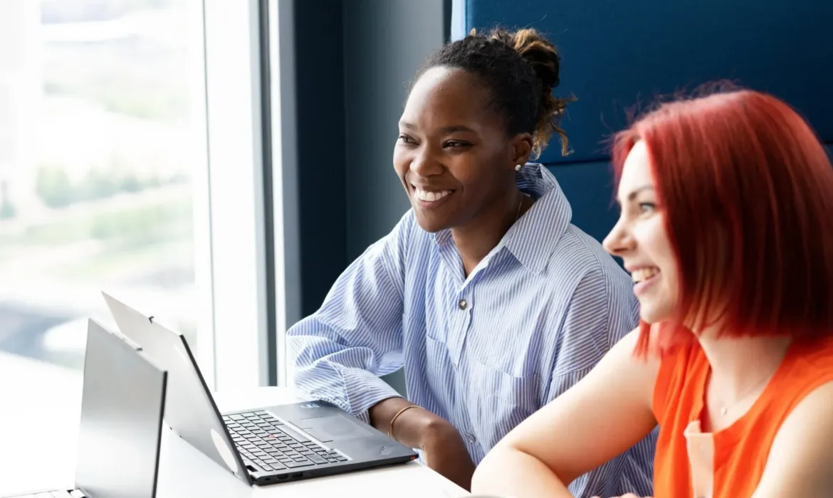 two female employees from UNICEF UK smiling