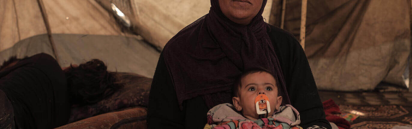 Sherihan is holding her six month old grandson, Mohammed.