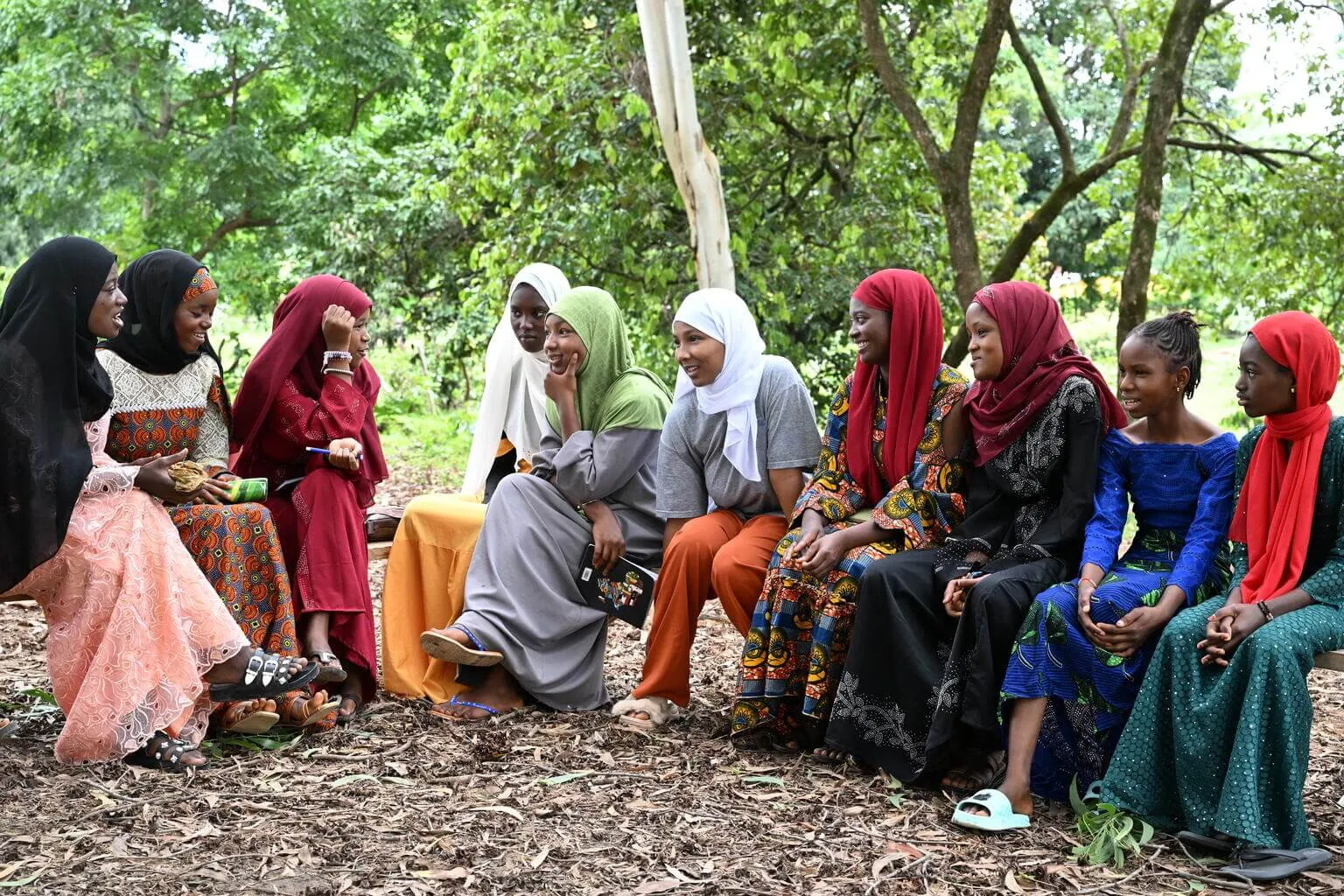 a group of girls talking to each other.